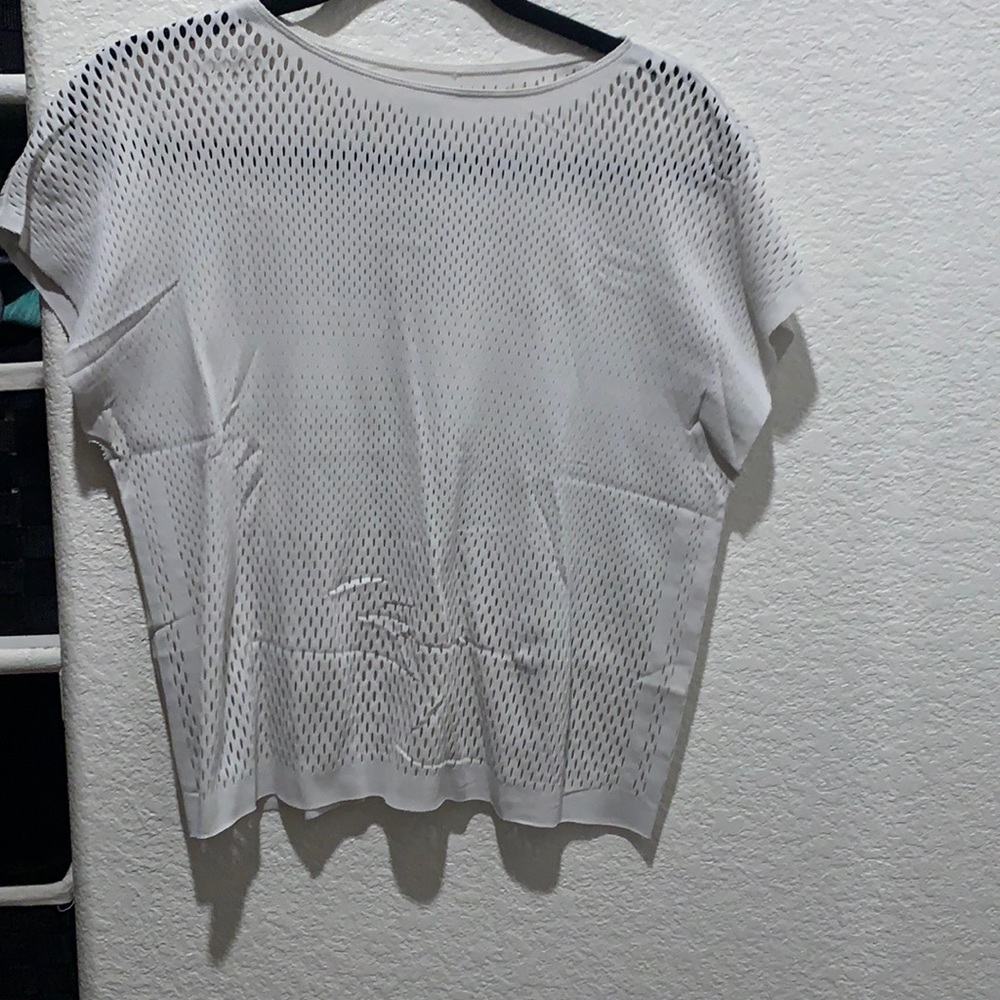 Adidas white top special edition.  Medium